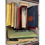 A Box containing various stamp guides, stamp albums and first day covers