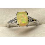 10ct white gold ladies ring set with a Ethiopian Opal off set with diamond shoulders. [3.01grams] [