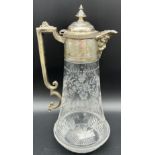 Antique claret jug designed with an ornate silver plate handle and spout, body is crystal with