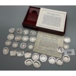 A Set of 26 solid silver miniature plate collection, comes with certificate and cards.