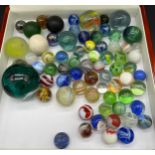 A Selection of vintage and antique glass marbles to include Antique German twist cane marbles.