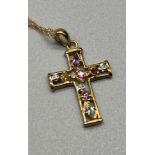 9ct yellow gold and gem stone cross pendant. fitted with diamonds, amethyst and citrine stones.