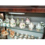 A Large shelf of victorian porcelain includes meissens style bottle jars, vases etc