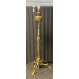 19th century rise and fall ornate brass paraffin floor standing light. [Converted to electric]