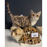 Two Collectable Winstanley cat figurines with glass eyes. both signed.