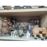 A Shelf of Elephant figures includes Quail porcelain elephant head, Green coloured elephant etc