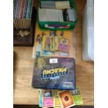 A collection of Pokémon trading cards , fortnight album etc