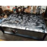 Modern low glass topped coffee table