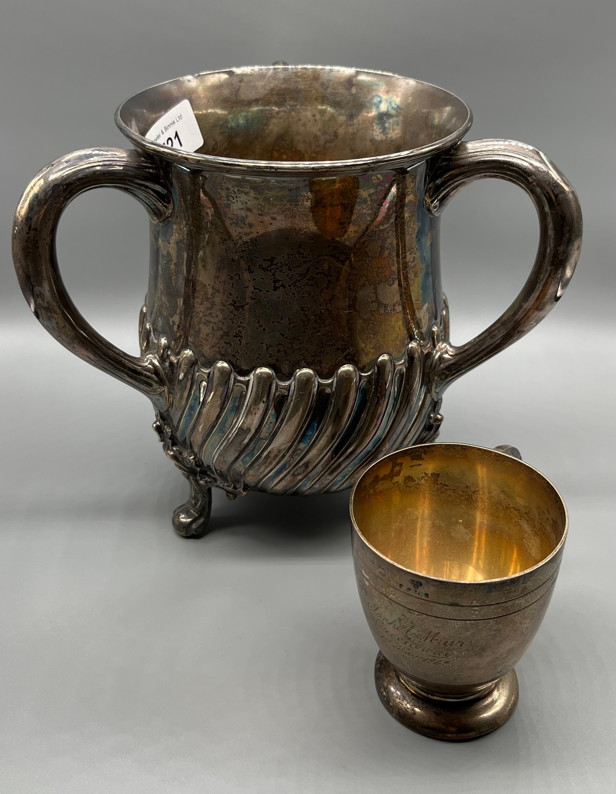 Edinburgh silver Hamilton and Inches three handle loving cup supported on three ornate feet.