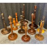 A Collection of antique turned wood table lamp bases.