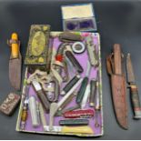 A Tray containing a collection of fruit knives, Military knives and advertising tins- Sullivan