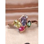 10ct yellow gold ladies ring set with various gem stones to include diamonds stones, Emerald stone