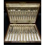 A Boxed canteen of silver plate forks and knives all designed with mother of pearl handles.