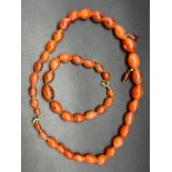Antique/ vintage amber coloured graduating bead necklace with matching bracelet and a pair of drop