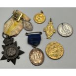 Preserve dish containing various antique medals.