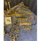 A collection of Antique brass and mixed metal door handles