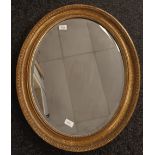 Vintage oval mirror within a moulded frame. [72x56cm]
