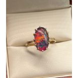 9ct yellow gold ladies ring set with a faux opal stone. [Ring size K] [1.88Grams]