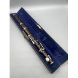 Rosewood made piccolo instrument with protective box.