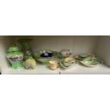 A Shelf of collectables includes Carlton ware leaf plates, Maling lustre wares includes temple