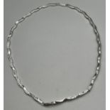 9ct white gold evening necklace detailed with design. [8.97grams]