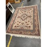 A Large Oriental themed rug