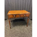 19th century side table., the rectangular top above two short drawers, raised on turned tapered legs