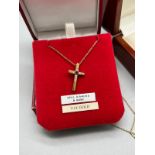 9ct yellow gold necklace with a 9ct yellow gold, diamond and ruby stone crucifix pendant.