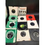 A Collection of 11 The Beatles 45s to include ' She loves you' , 'Rain', things we said today, Get