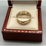 9ct yellow gold Celtic design band ring. [Ring size S] [3.12Grams]