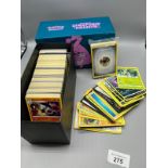 Pokemon Unified Minds box containing a large quantity of Pokemon cards also includes a sealed pack.