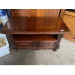 An ornate two drawer cabinet