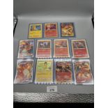 A Collection of protected Pokemon Charizard, Pikachu and Charmander