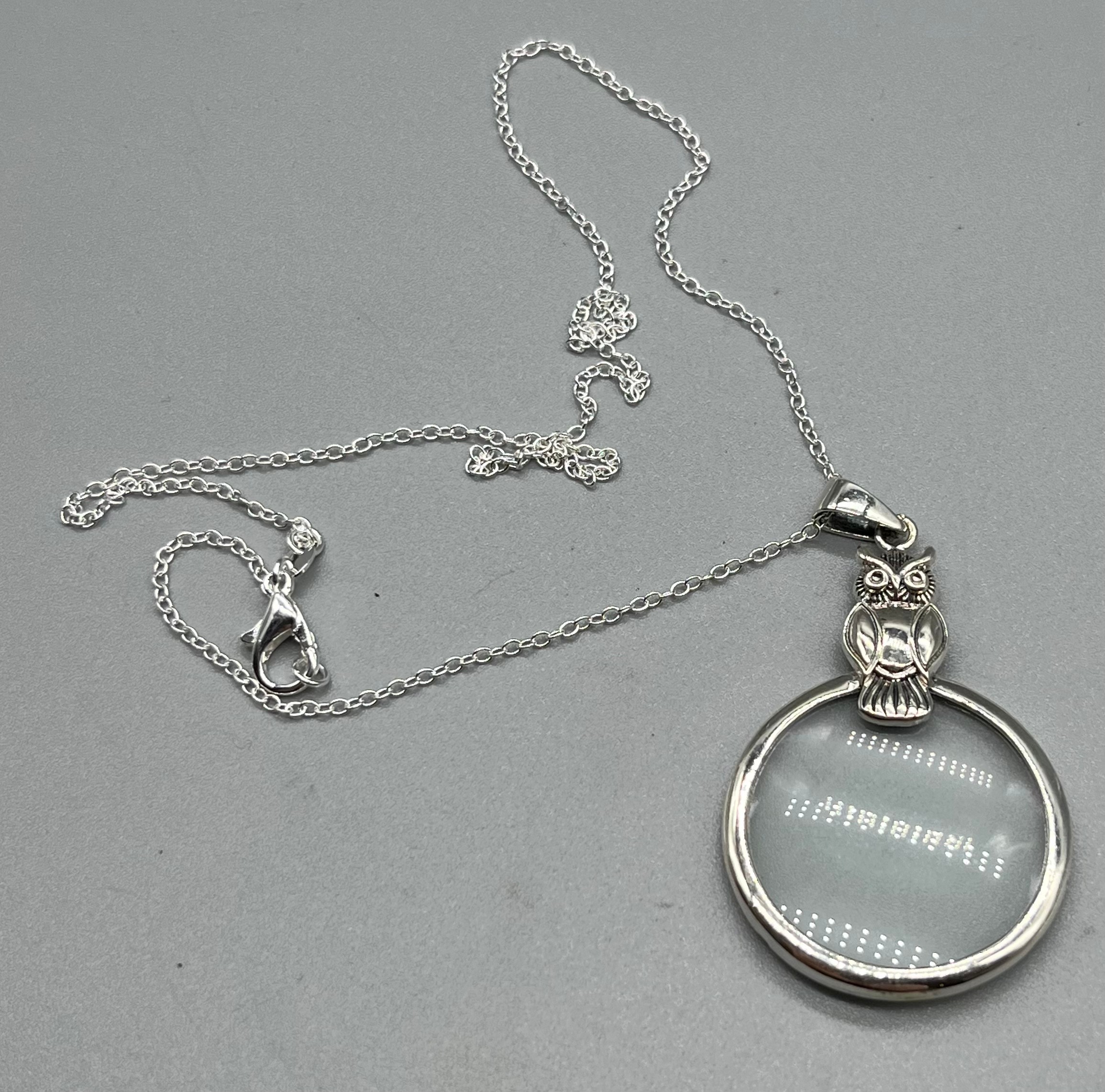 925 silver owl shaped magnifying glass pendant with silver necklace.