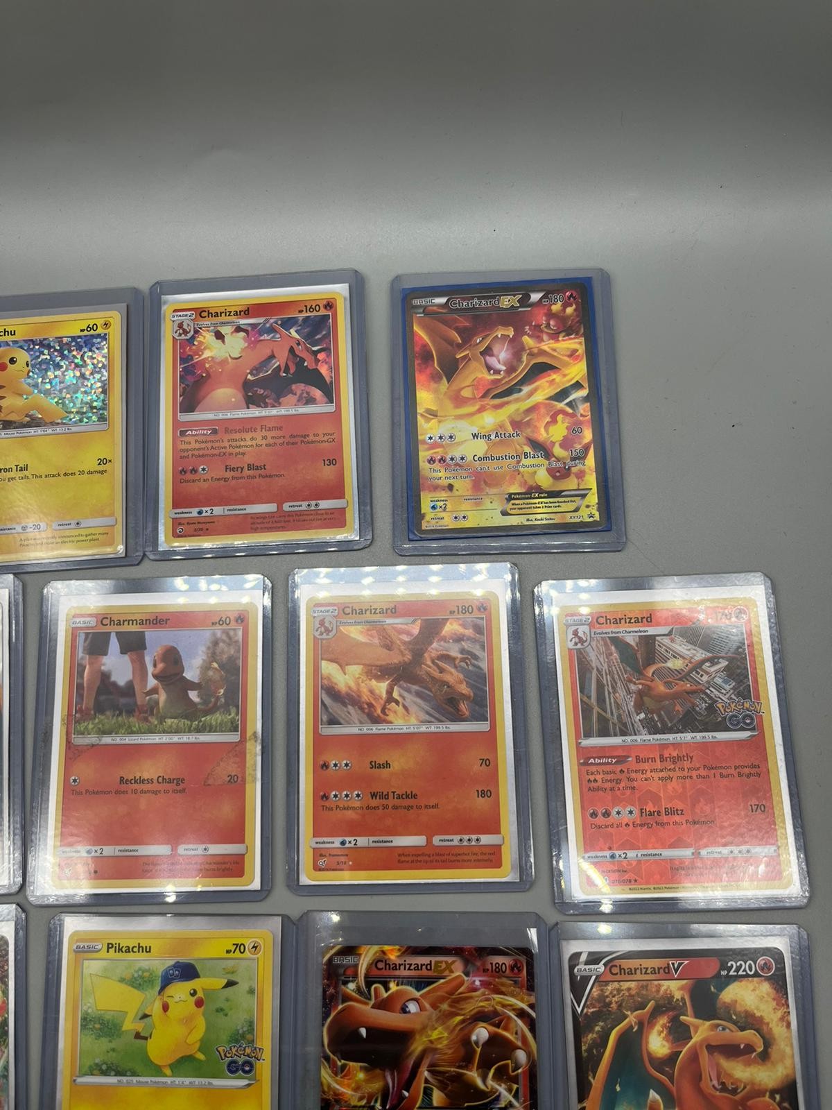 A Collection of protected Pokemon Charizard, Pikachu and Charmander - Image 2 of 2
