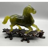 Antique Chinese hand carved Green Jade sculpture of a horse, Comes with carved wooden stand.