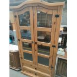 A Large mexican pine 2 door cabinet with fitted drawers
