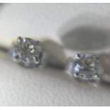 A Pair of 14ct white gold Diamond stud earrings 40cts in total.