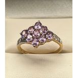 10ct yellow gold ladies ring set with purple and white topaz stones. [Ring size Q] [3.06Grams]