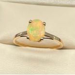 10ct yellow gold ladies ring set with a single Ethiopian opal stone. [Ring size R] [1.66Grams]