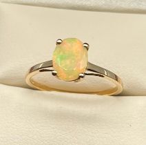 10ct yellow gold ladies ring set with a single Ethiopian opal stone. [Ring size R] [1.66Grams]