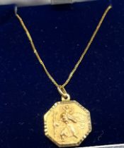 9ct yellow gold necklace with gilt metal St Christopher pendant.