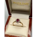 9ct yellow gold ladies Ruby and diamond cluster ring. 0.15ct diamonds. [Ring size R] [2.36Grams]
