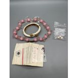 A Selection of Ruby and Sapphire loose gem stones, Glass worked bead necklace and gilt costume