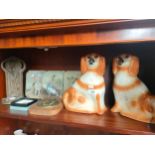 A Shelf of collectables includes pair of wally dogs, early Scottish coins, early medallion plaque,