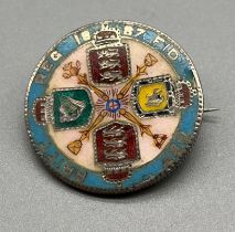 1887 Silver and enamel worked Queen Victoria coin brooch.