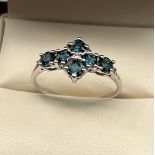 10ct white gold ladies ring set with 6 blue stones. [Ring size P] [1.81Grams]