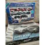 Boxed james bond Scalextrics along with classic train set