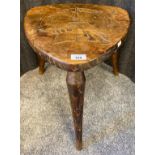 Antique/ vintage stool with hand carved insignia to the top. Supported on three turned legs, stamped