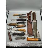 A Collection of vintage hunting and tool working knives. Includes military dock yard knife and